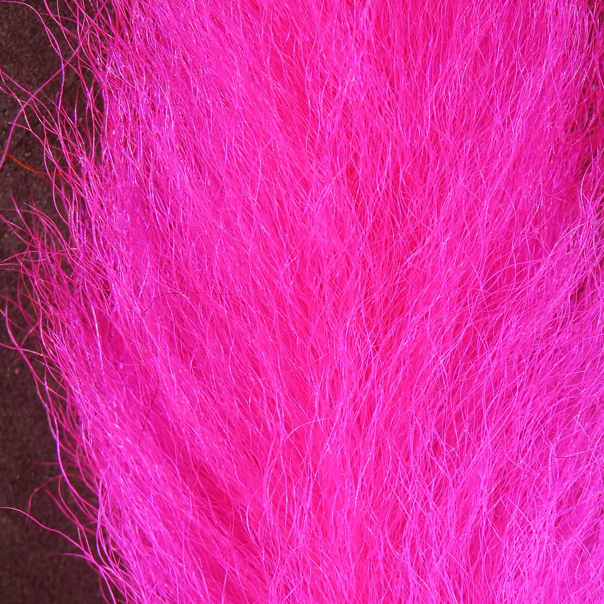 Hot pink Hareline calf tails for fly tying, long wispy hair fibers with soft glossy texture