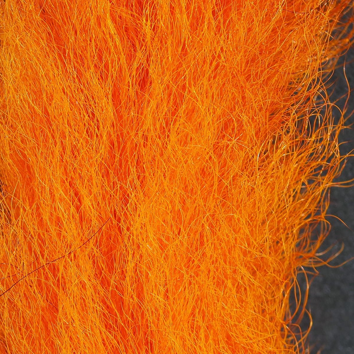 Bright orange calf tails, dense long natural hair fibers for fly tying