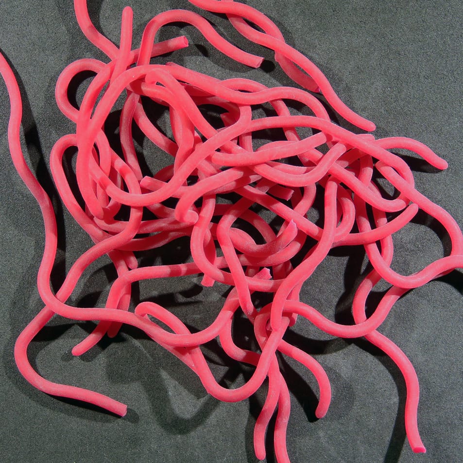 Neon pink soft rubber tubular worm strands, squirmy lure material for fly tying