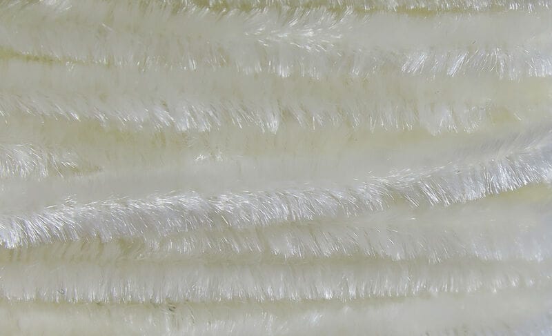 White pearlescent Hareline chenille with dense shiny synthetic fibers in parallel fuzzy stems