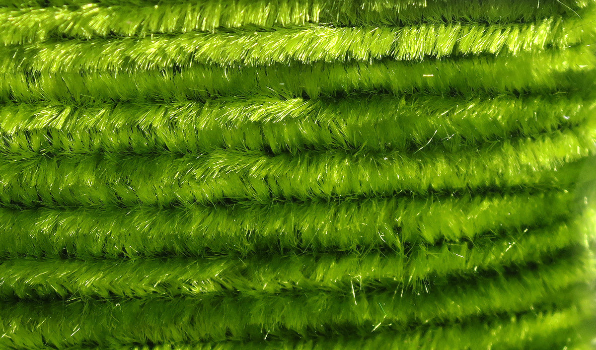 Bright chartreuse Hareline chenille close-up showing fuzzy, plush synthetic yarn texture for fly tying