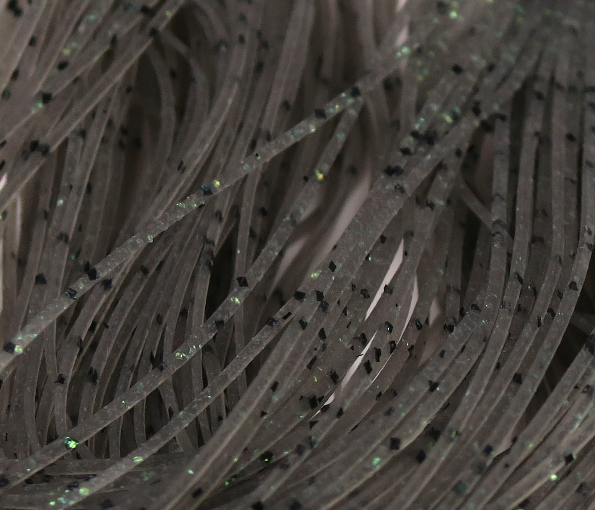 Hareline Crazy Legs brown translucent rubber legs with black speckles and green iridescent glitter for fly tying