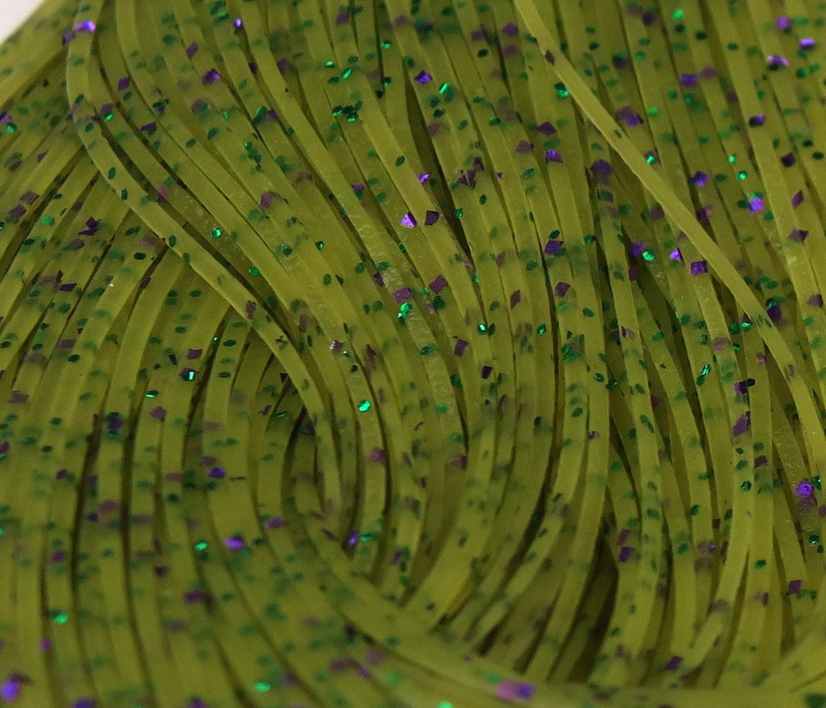 Chartreuse olive silicone Crazy Legs rubber strips with green and purple holographic flakes for fly tying, thin strands
