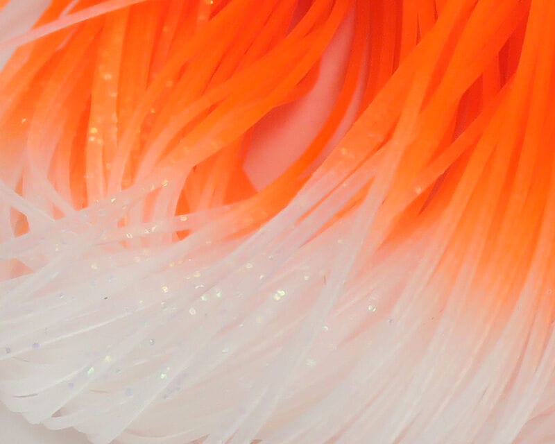Hareline Crazy Legs translucent rubber legs, neon orange fading to white with iridescent glitter — fly tying material