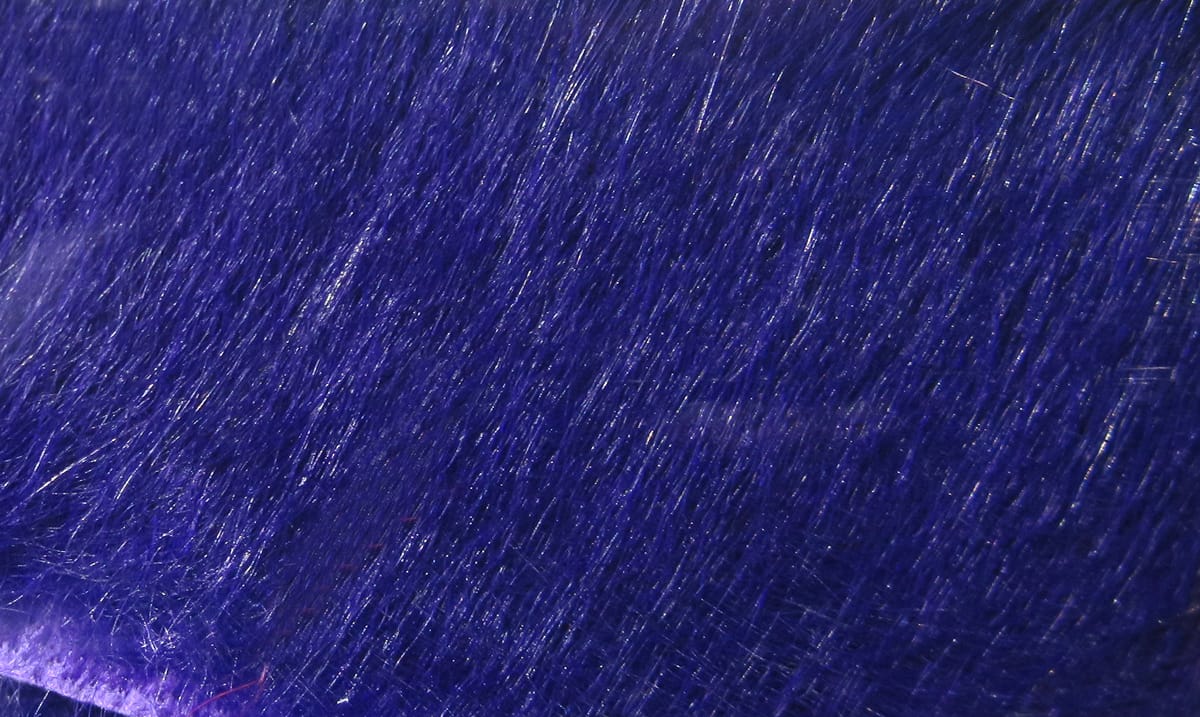 Deep royal purple crosscut rabbit fur strip with fine glossy hairs, dense texture for fly tying