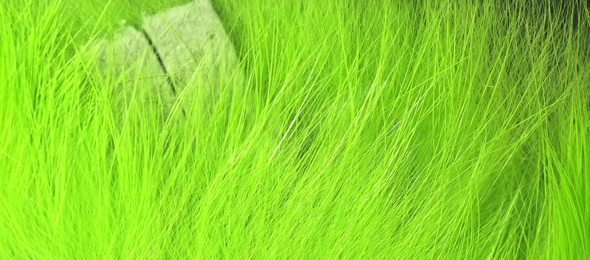 Bright chartreuse Hareline crosscut rabbit fur strips with long soft fibers for fly tying