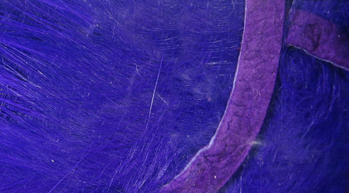 Purple crosscut rabbit fur strips with long soft fibers and suede backing for fly tying