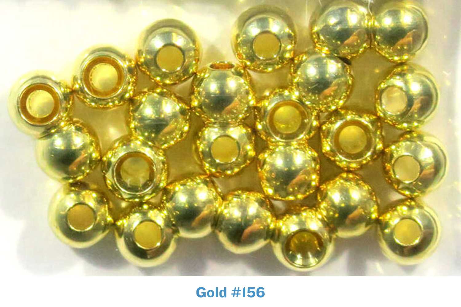 Gold Hareline Cyclops bead eyes, shiny metallic spherical fly-tying beads with central holes for threading