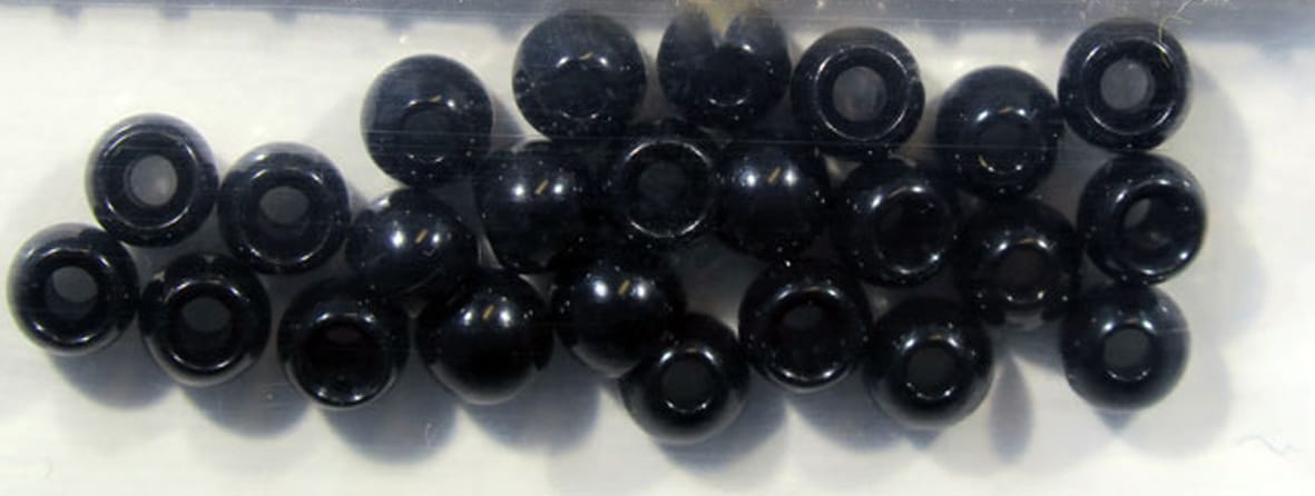 Hareline Dazzle glossy black brass fly-tying beads, round donut-shaped with large center holes