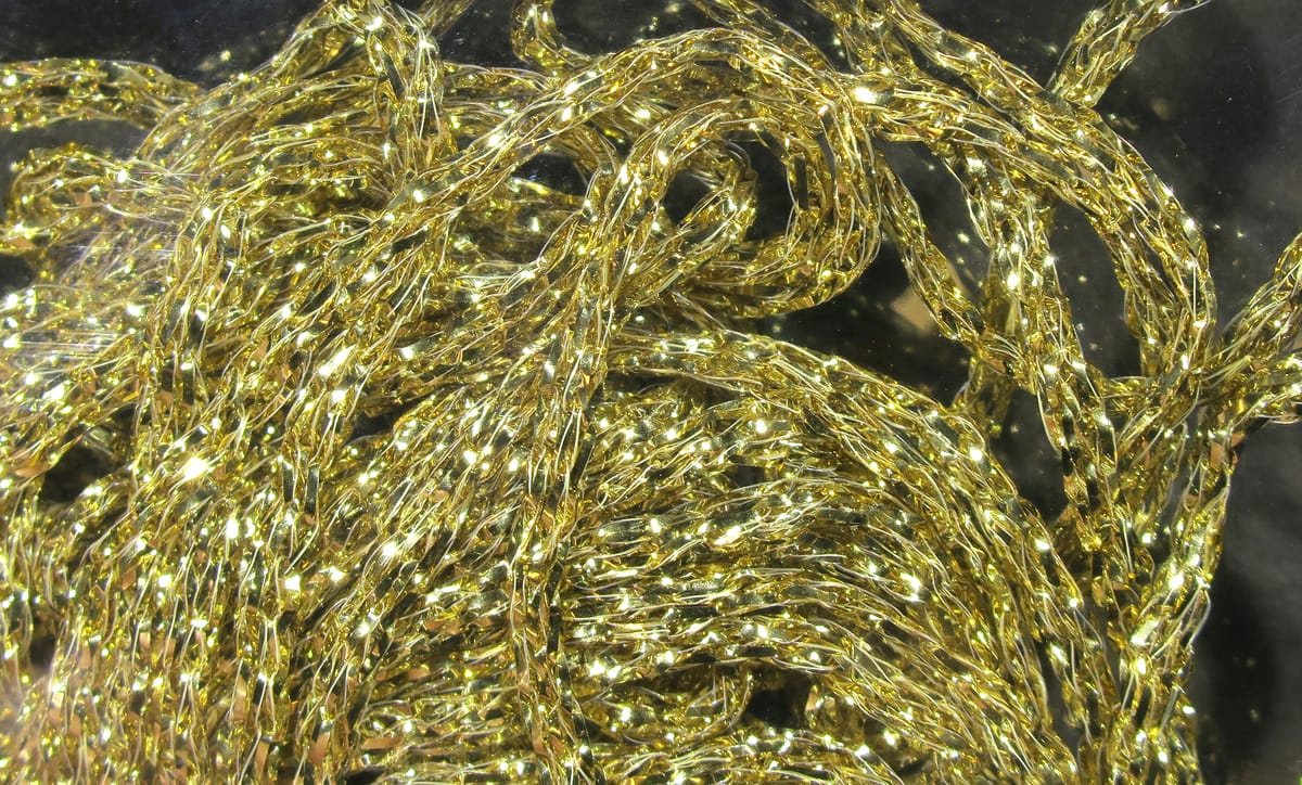 Shiny gold braided metallic tinsel Hareline Diamond Braid for fly tying, twisted reflective strands and braided texture