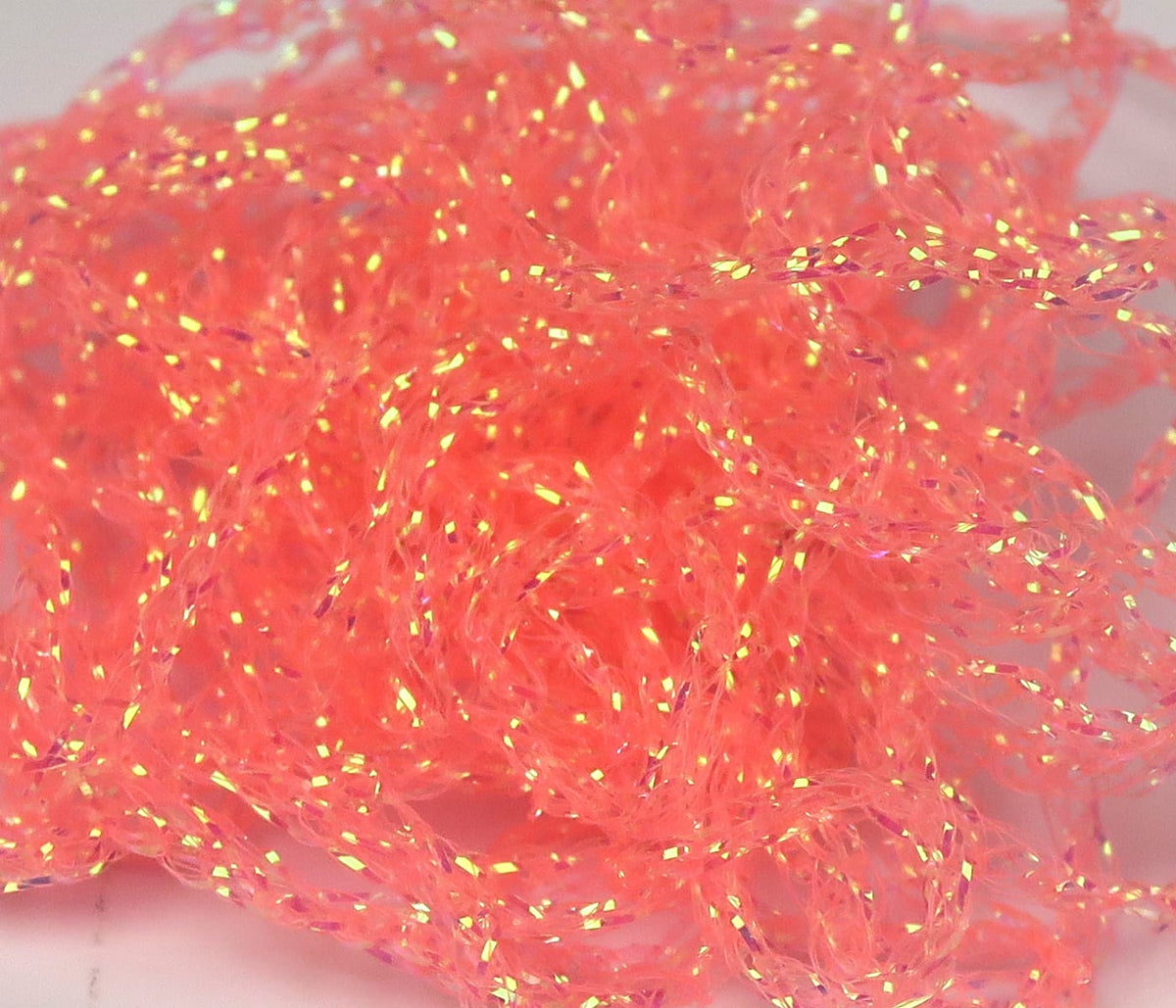 Hareline Diamond Braid fly tying material, coral orange iridescent synthetic braid with gold flash and twisted strands