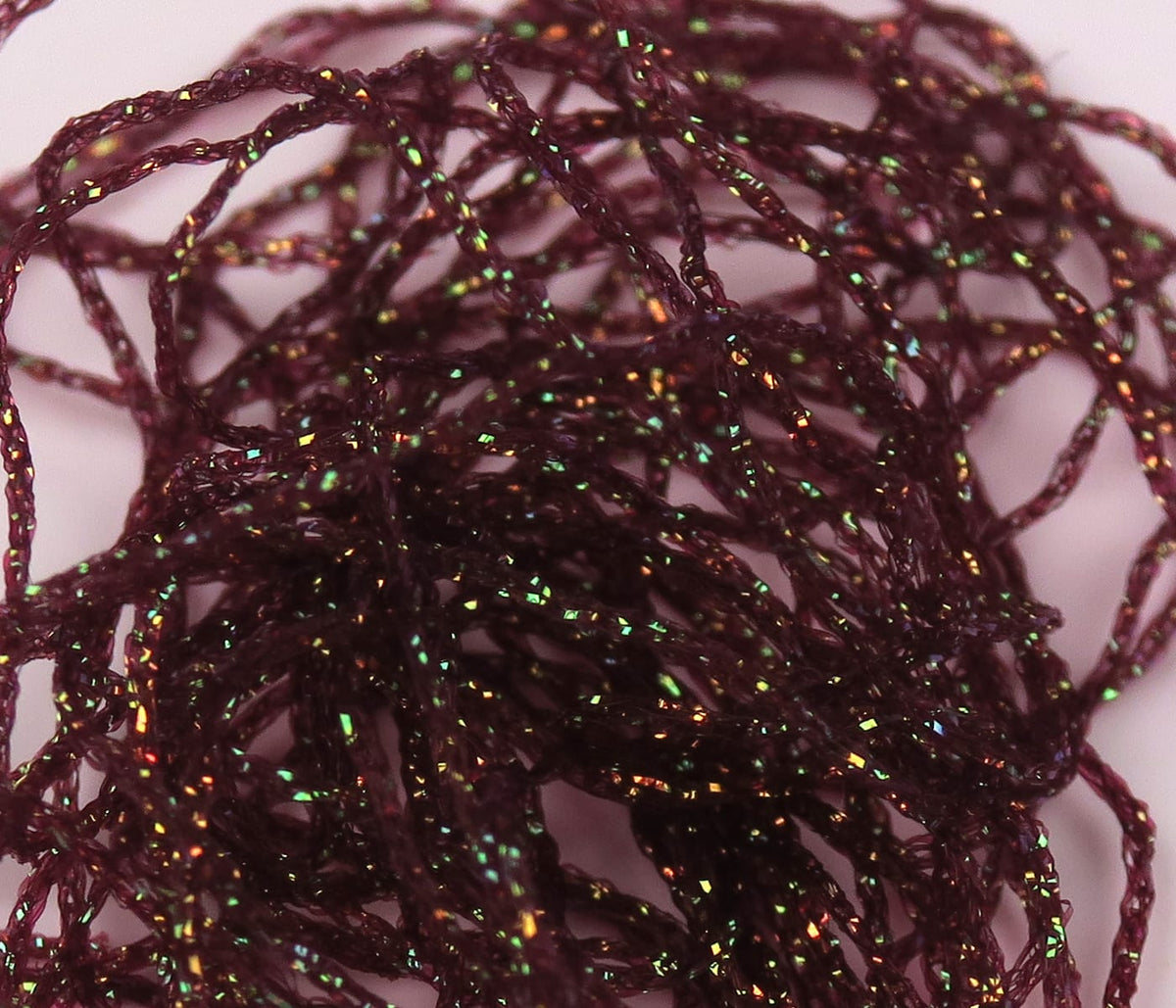 Hareline Diamond Braid maroon synthetic braid for fly tying with twisted strands and green-copper iridescent sparkle