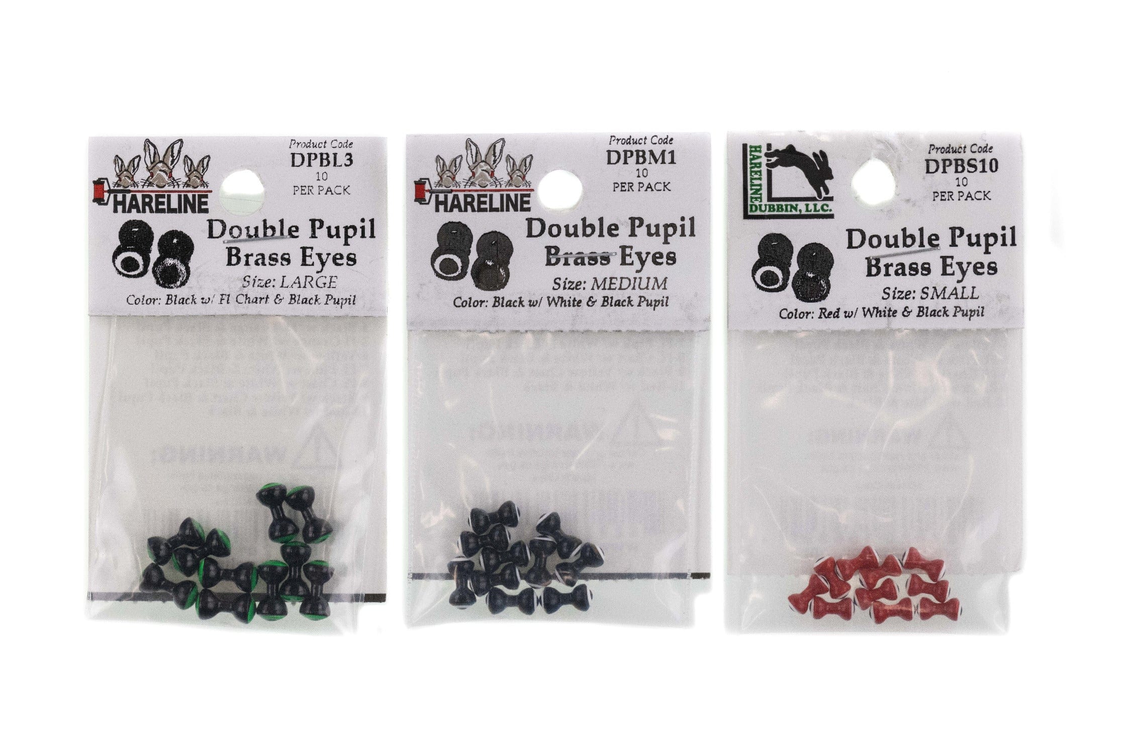 Three Hareline double pupil brass eyes in clear packaging for fly tying, black/green, black, and red small sizes visible