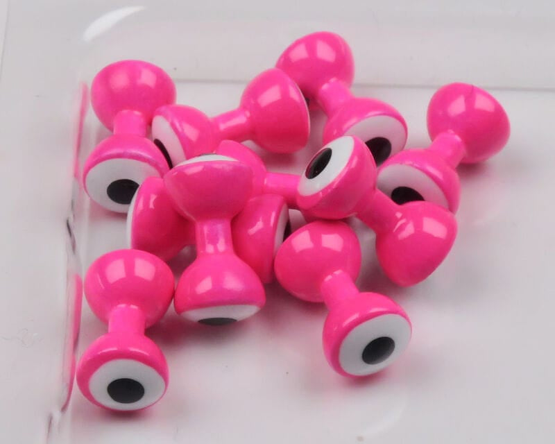 Glossy hot pink double-pupil brass eyes for fly tying with white rims and black pupils, dumbbell style