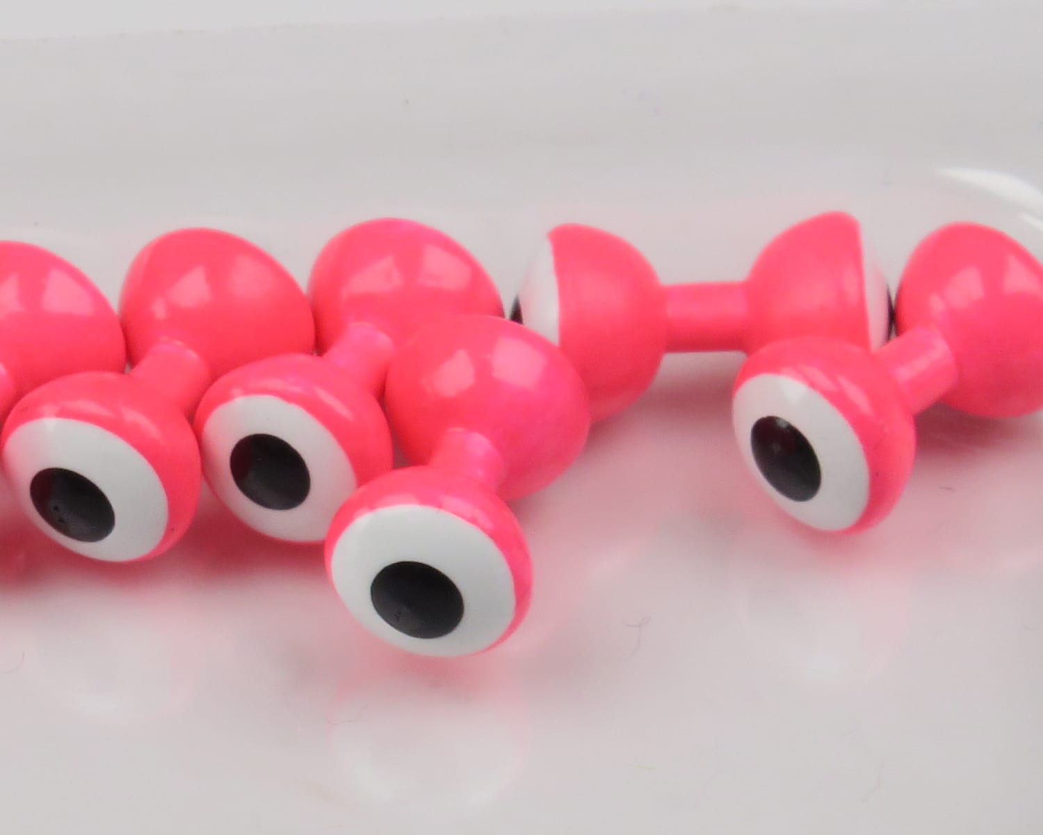 Neon pink glossy double-pupil lead eyes with white rings and black pupils for fly tying