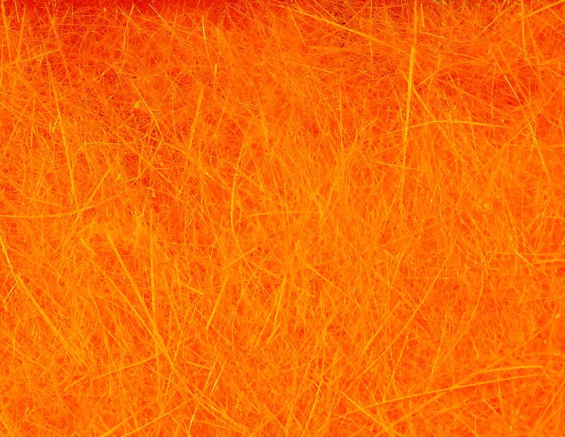Hareline Dubbin bright orange loose fibrous dubbing with fine wispy hairs for fly tying