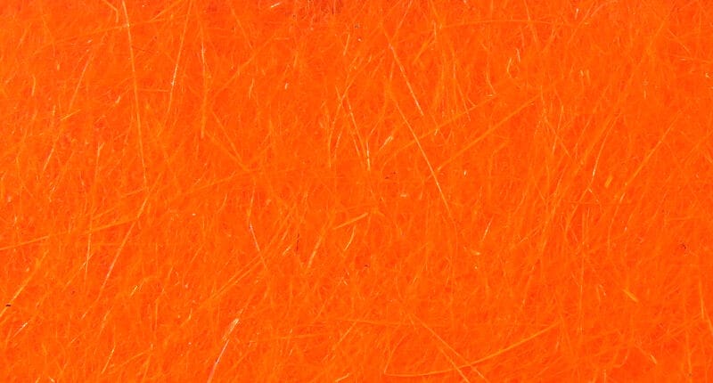 Bright orange Hareline dubbin fiber mass with fine synthetic hairs and subtle sheen for fly tying dubbing