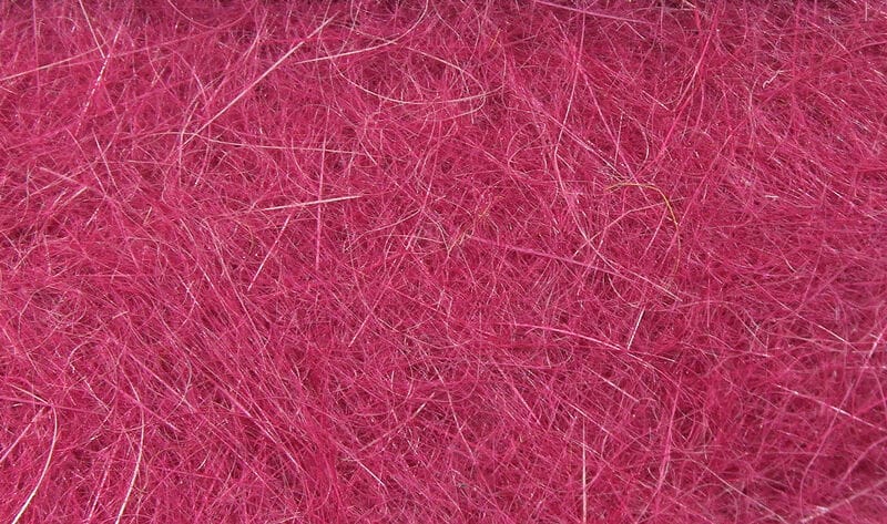 Magenta Hareline dubbin fibers for fly tying, fluffy tangled synthetic and natural hairs with subtle shiny guard strands
