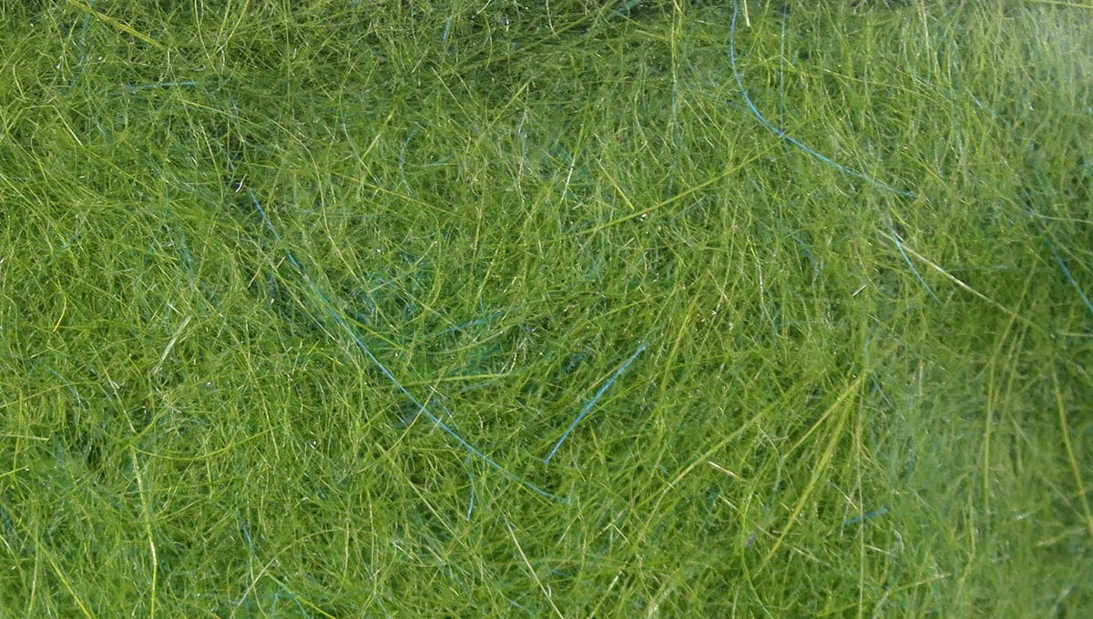 Olive green Hareline dubbing with fine blue flash fibers, fuzzy fly tying dubbing material
