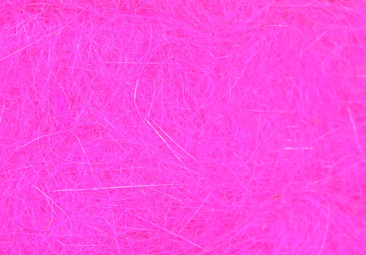 Hareline Dubbin fly tying material in bright hot pink, fine fibrous strands with subtle iridescent sheen