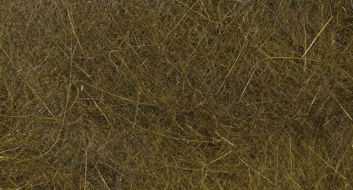 Olive-brown Hareline Dubbin fibers with fine hair-like strands and subtle flash for fly tying