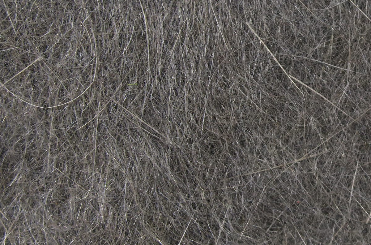 Dark gray Hareline dubbing: fine wispy rabbit fur fibers with soft, slightly glossy texture for fly tying