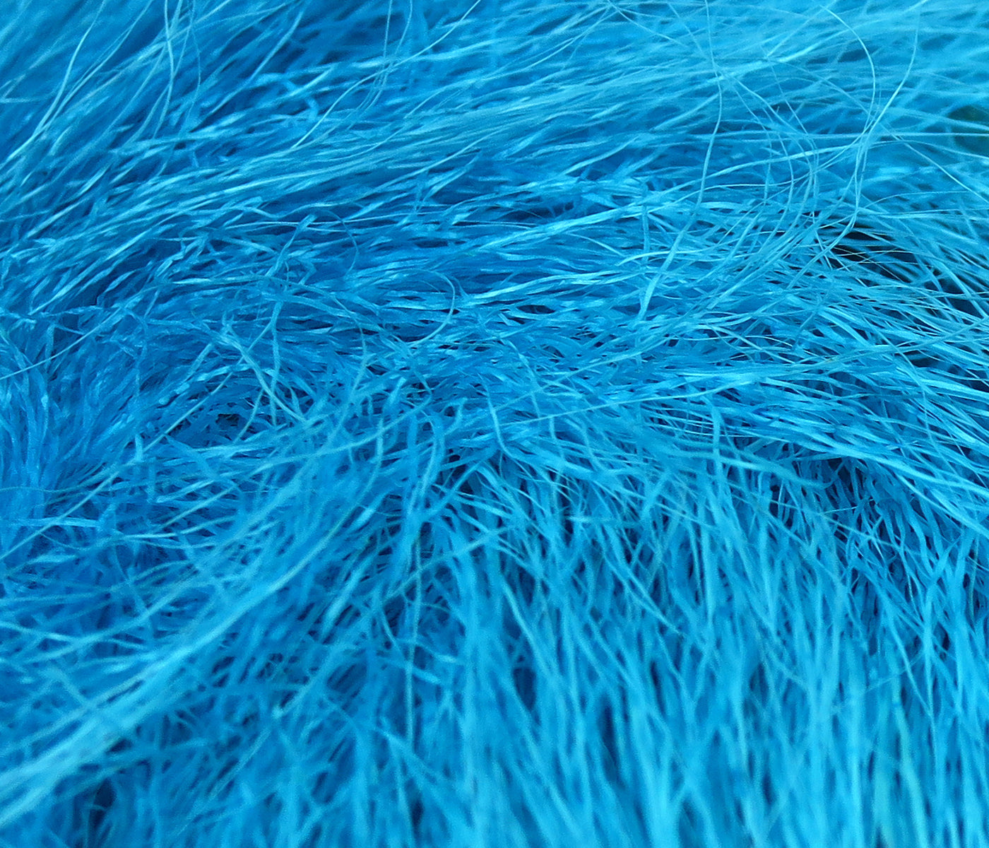Bright turquoise dyed deer belly hair, fine soft strands for fly tying by Hareline