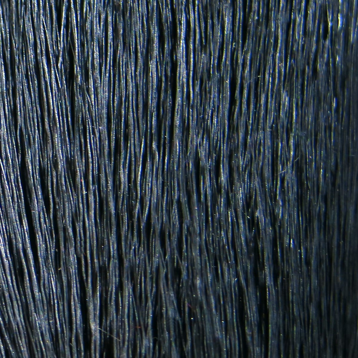 Dark navy dyed deer belly hair strands with glossy blue sheen, long fine fibers for fly tying
