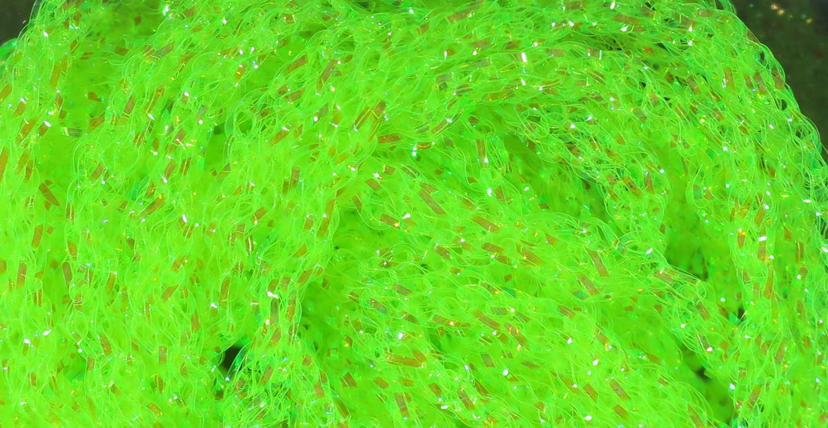 Hareline dyed pearl diamond braid in bright chartreuse green, iridescent synthetic braided strands for fly tying.