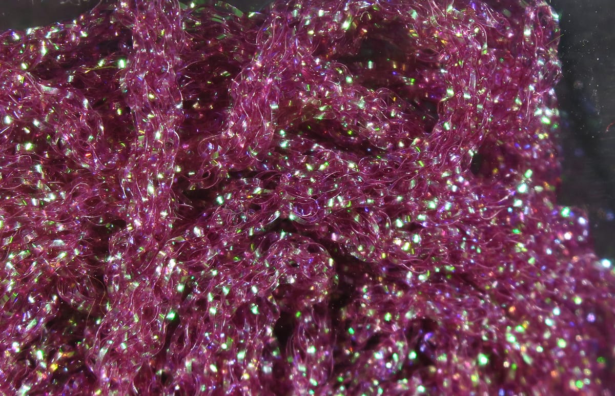 Hareline dyed pearl diamond braid, magenta-purple iridescent synthetic braid with green sparkle for fly tying