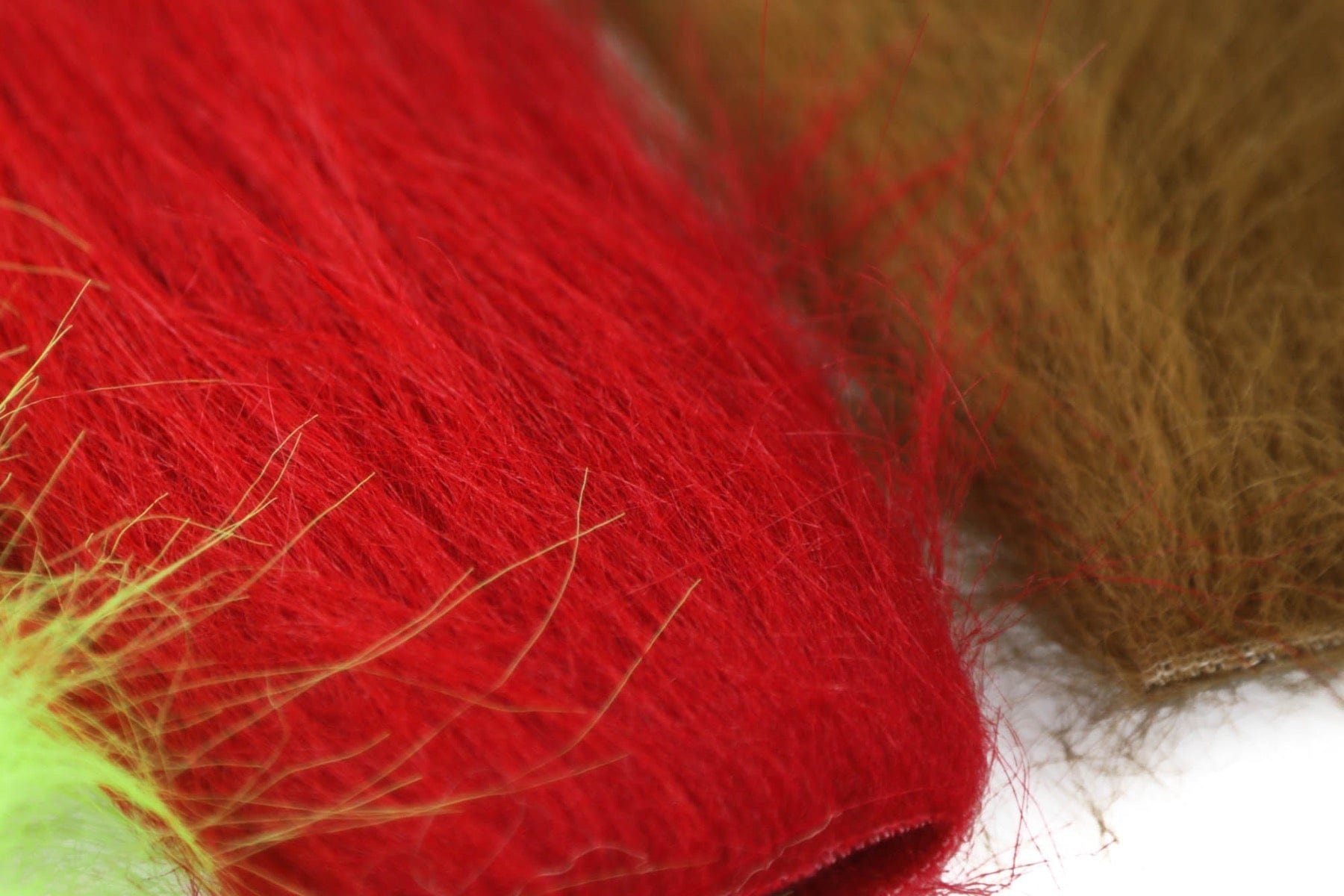 Hareline Extra Select craft fur close-up showing bright red and brown soft synthetic fibers for fly tying