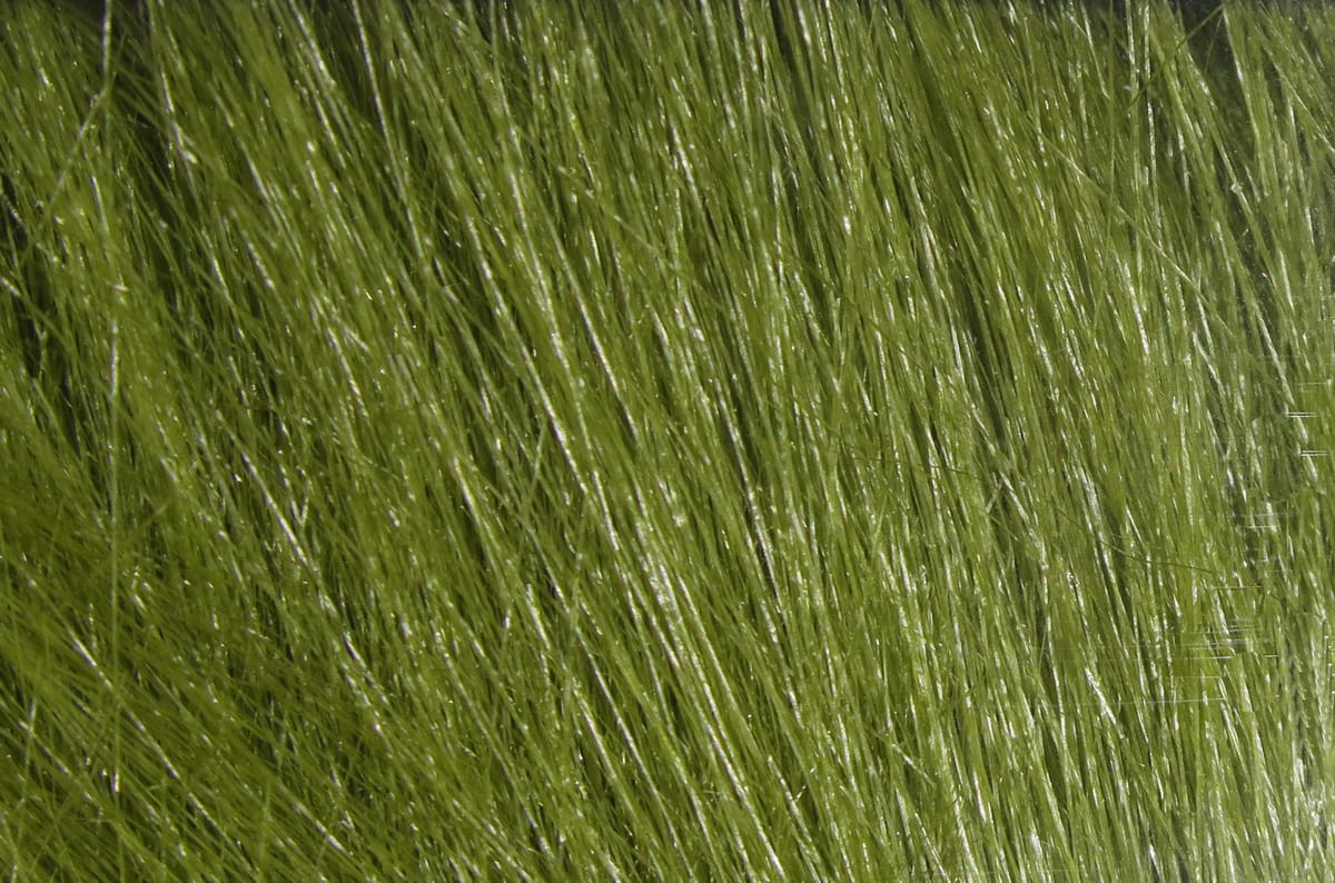Olive green Hareline Extra Select craft fur with glossy, long fine synthetic fibers for fly tying