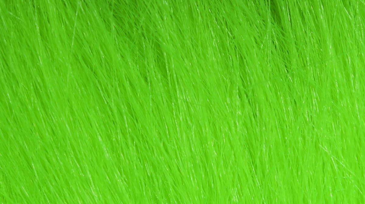 Hareline Extra Select craft fur in fluorescent chartreuse green, long fine synthetic fur fibers for fly tying