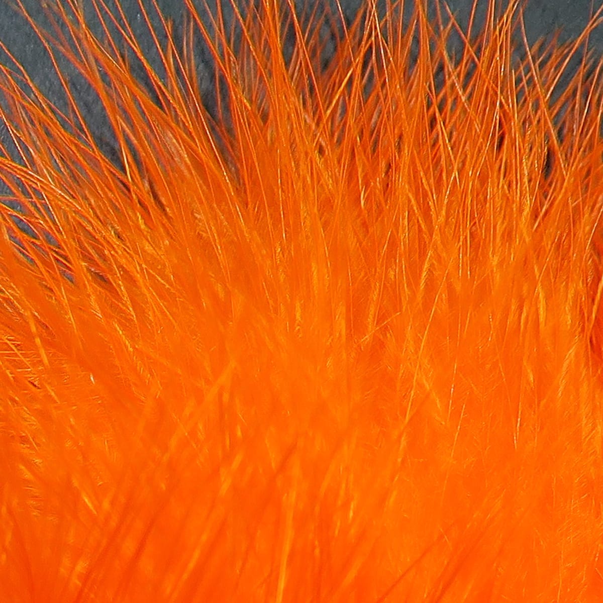 Bright orange marabou feathers, fluffy soft filaments with fine barbs and glossy tips for fly tying