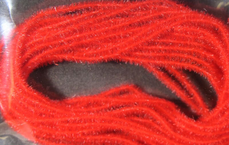 Bright red synthetic fuzzy dub strands, chenille-style Hareline EZ Magic Dub, looped fly tying material