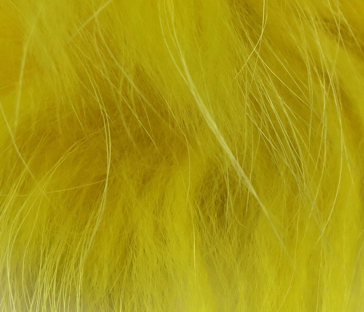 Bright chartreuse raccoon fur zonker strip with long soft guard hairs for fly tying