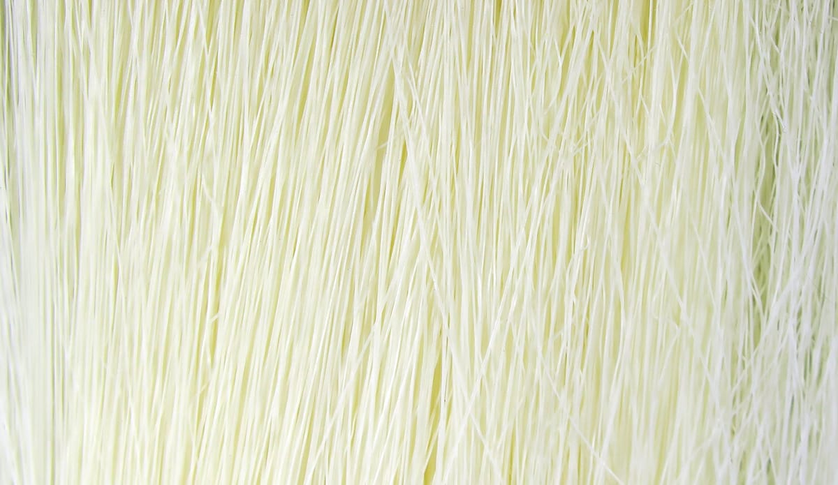 Pale chartreuse Hareline Fishair glossy synthetic fly-tying fibers, thin bundled strands for streamer patterns