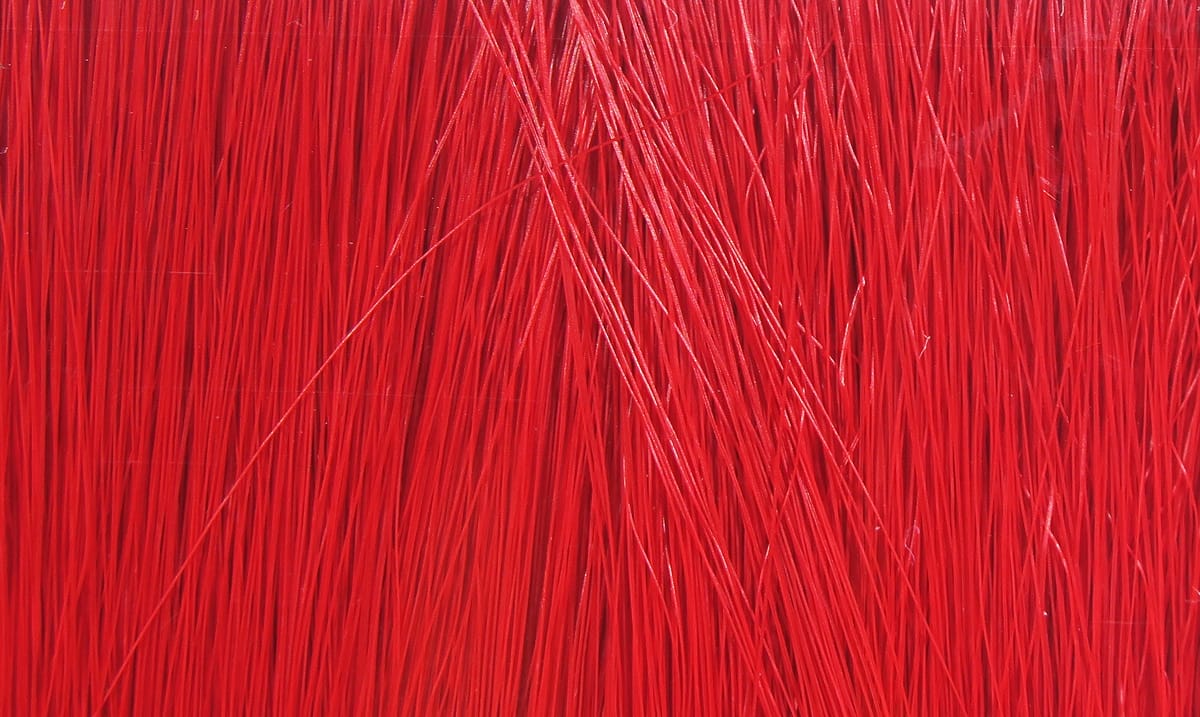 Bright red Fishair synthetic hair, thin glossy strands for fly tying