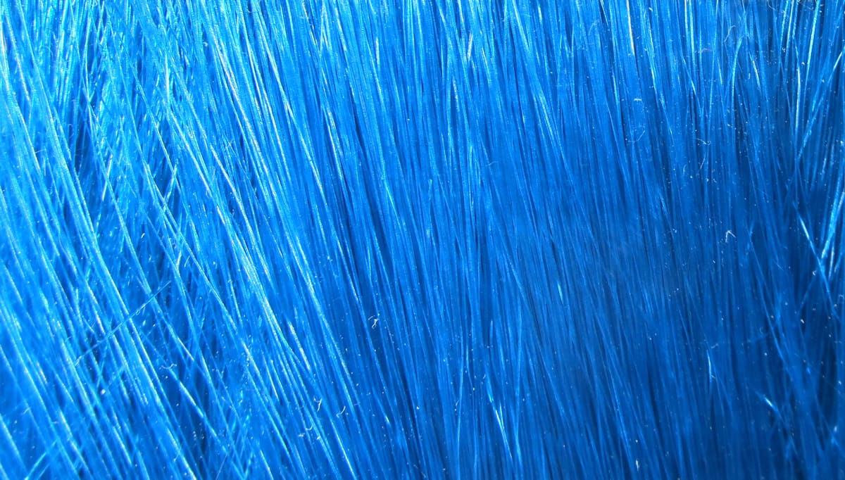 Vibrant electric blue Hareline Fishair synthetic hair fibers, glossy long strands for fly tying and streamer bodies