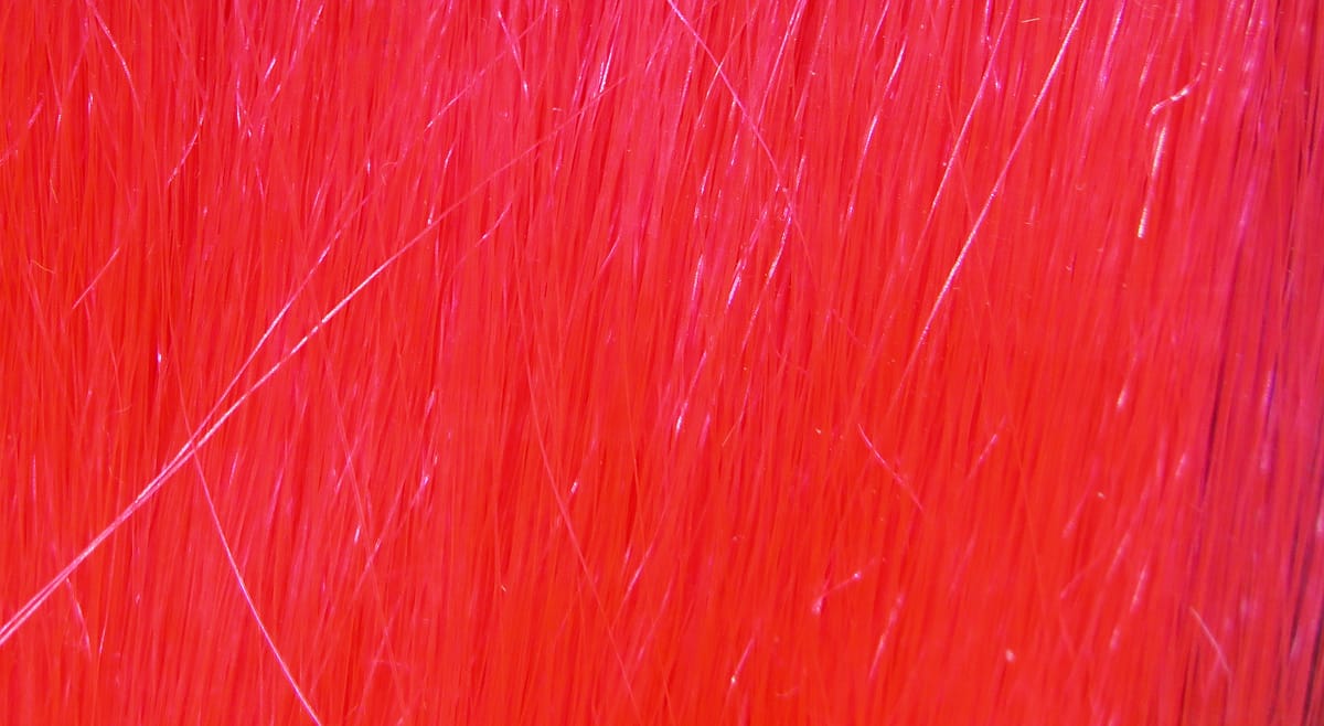 Hareline Fishair bright red synthetic hair for fly tying, glossy fine long fibers with subtle iridescent flash
