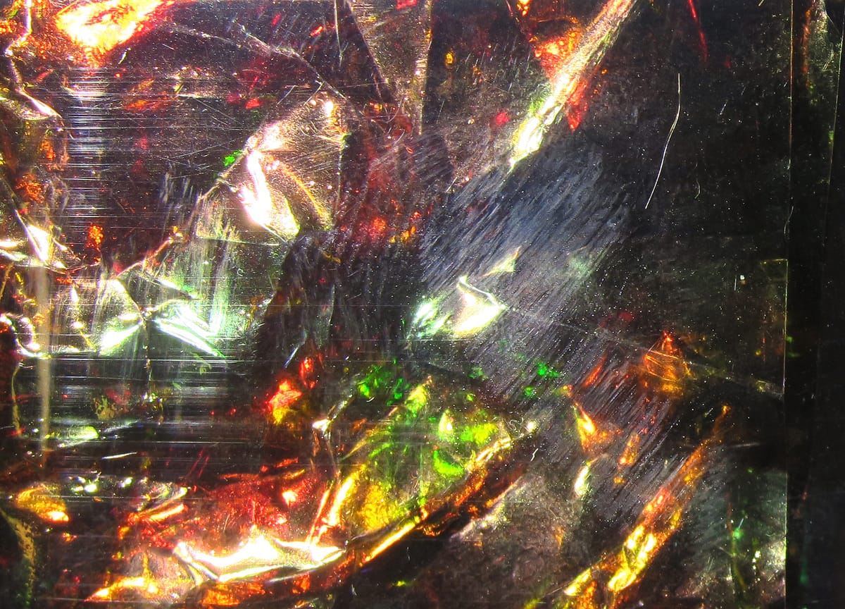 Hareline Flashback iridescent crinkled mylar film with red, green and gold reflective highlights for fly tying
