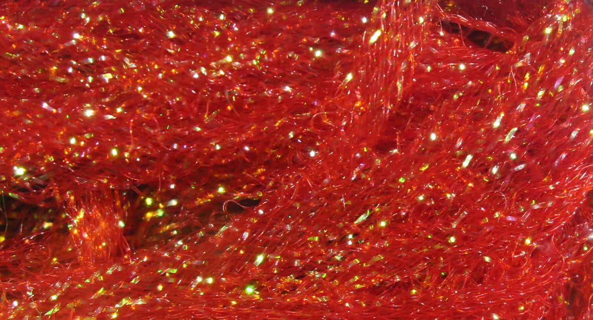 Hareline Flat Diamond Braid in red sparkly synthetic fibers with iridescent green flashes for fly tying
