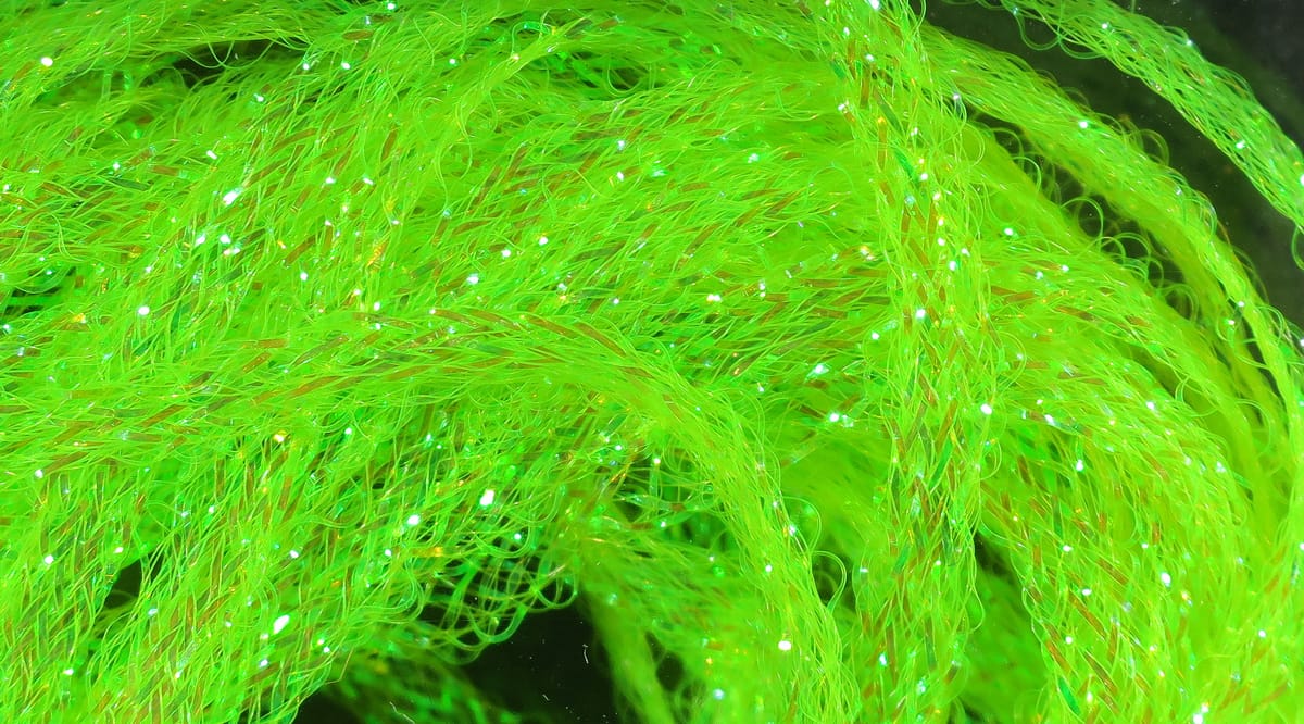 Hareline Flat Diamond Braid in neon chartreuse: flat synthetic braided fly tying material with iridescent sparkling fibers