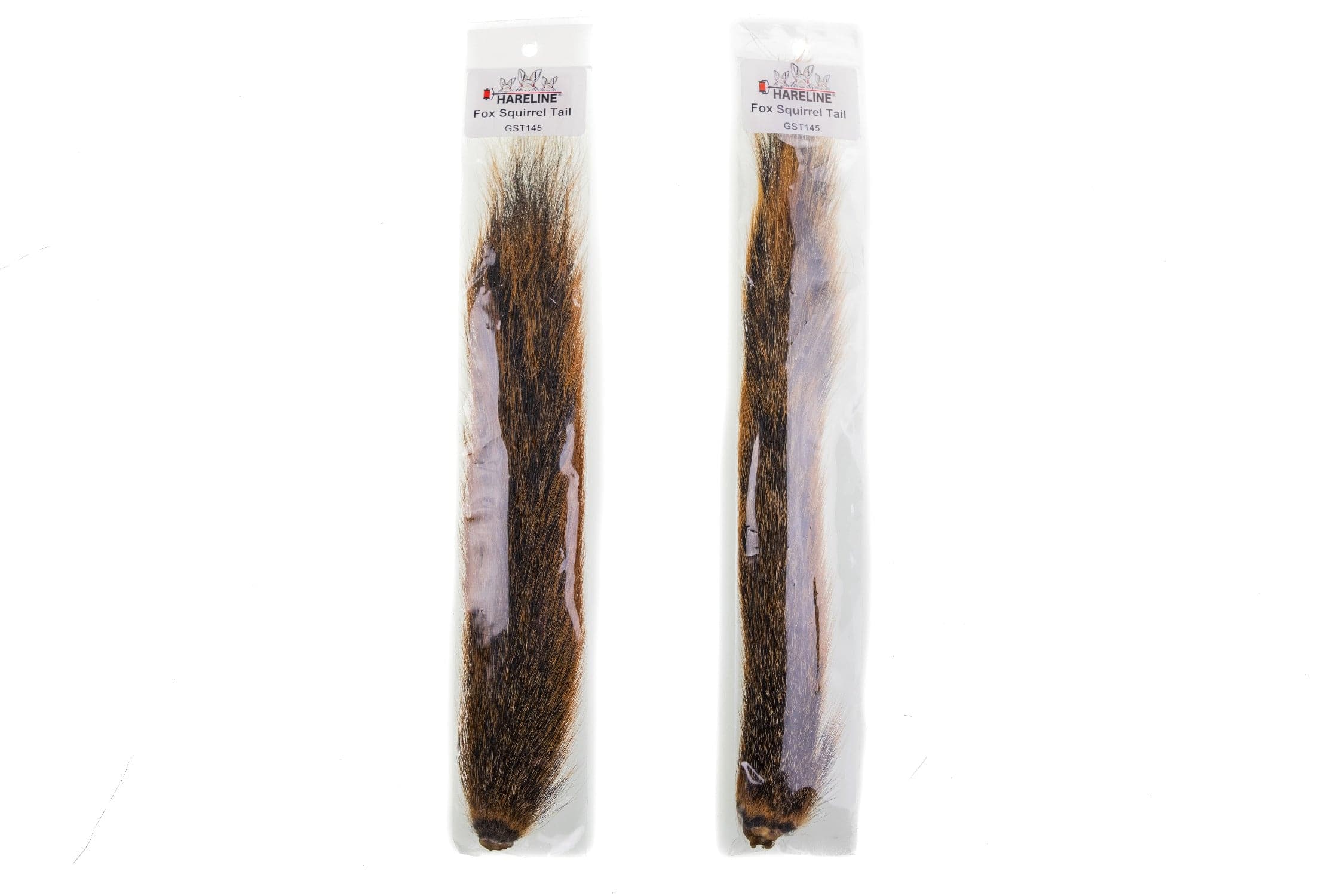 Hareline fox squirrel tail strips, long natural brown and tan fur in clear plastic packaging for fly tying