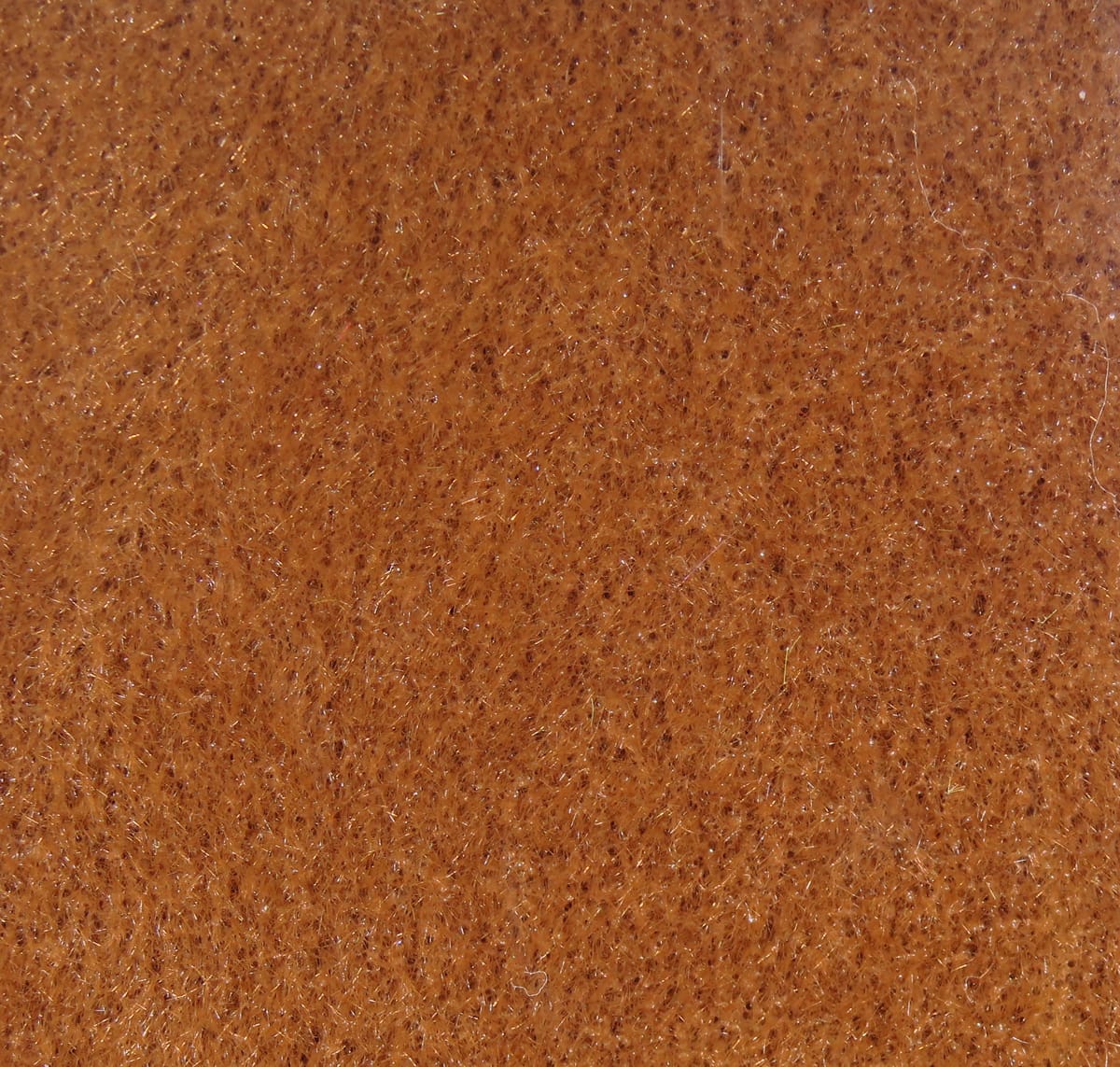 Brown cinnamon furry foam sheet with short fuzzy fibers and subtle iridescent flash for fly tying