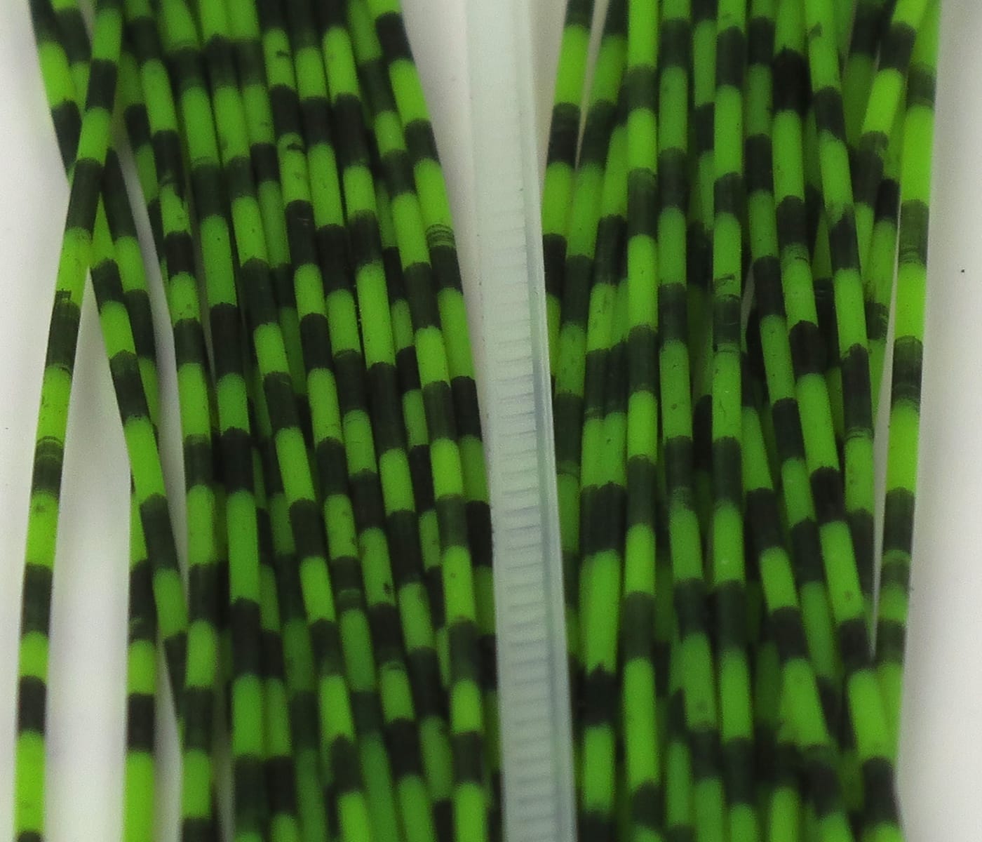 Bright green and black grizzly barred rubber legs for fly tying, flexible striped rubber strands