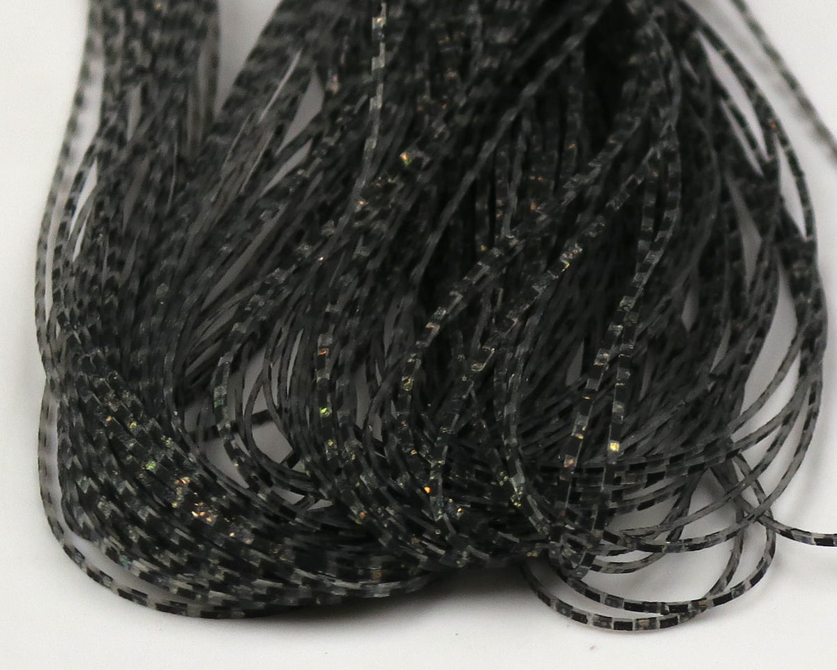 Hareline Grizzly Micro Legs black segmented rubber fly tying legs with subtle iridescent flakes and grizzly striping