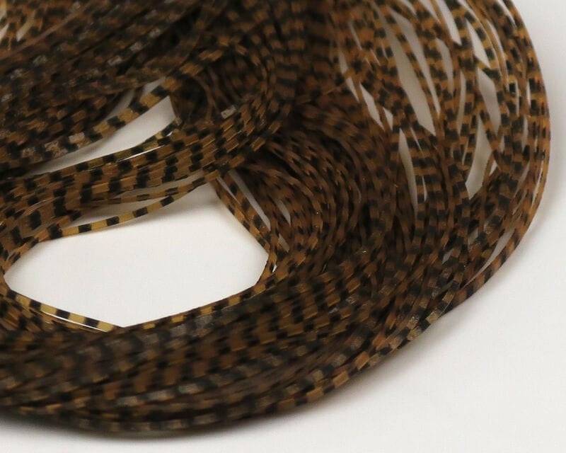 Hareline Grizzly Micro Legs: coiled translucent brown synthetic legs with fine black grizzly bars for fly tying