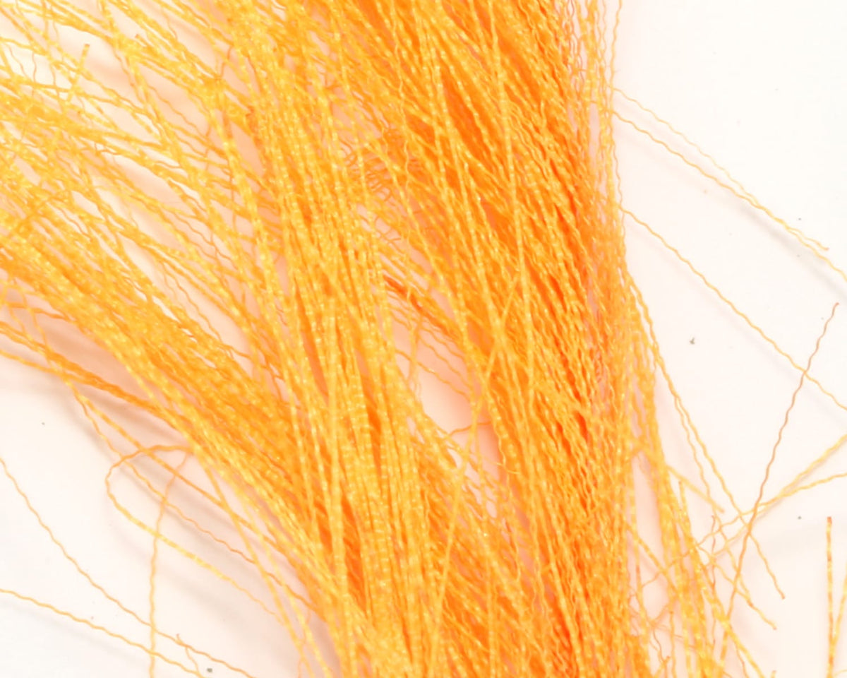 Bright orange synthetic hackle hair strands with fine crinkled fibers for fly tying