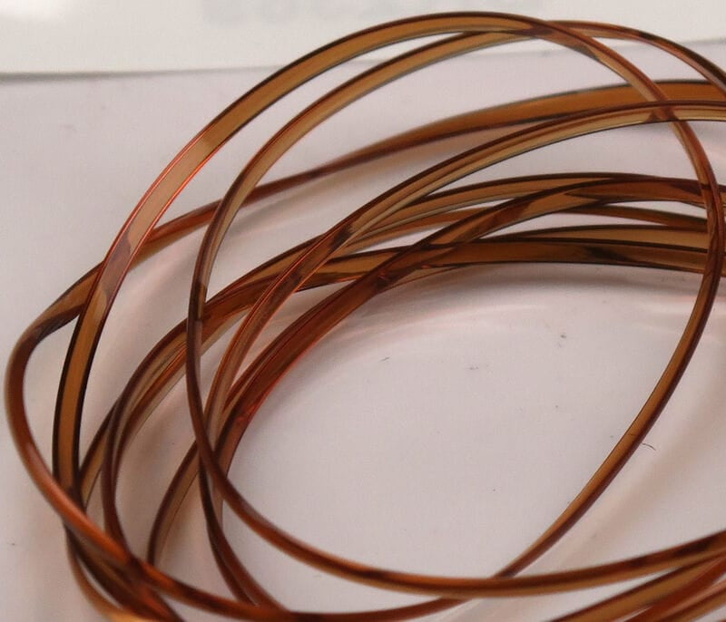 Amber/copper translucent half-round D-rib coils, thin plastic ribbing for fly tying